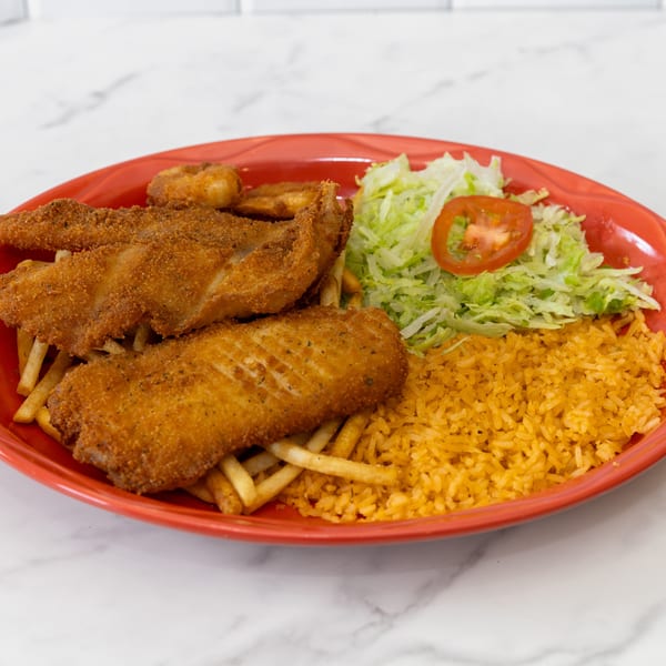 La Unica Mexican Restaurant's fried fish and shrimp with fries, rice, and shredded lettuce with tomato.